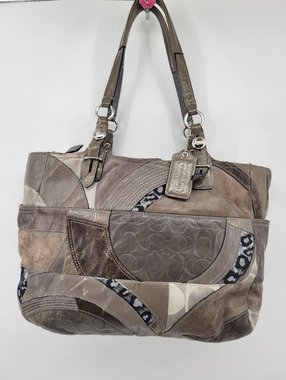 Coach F15459 is a vintage mixed-media patchwork tote bag Y2K